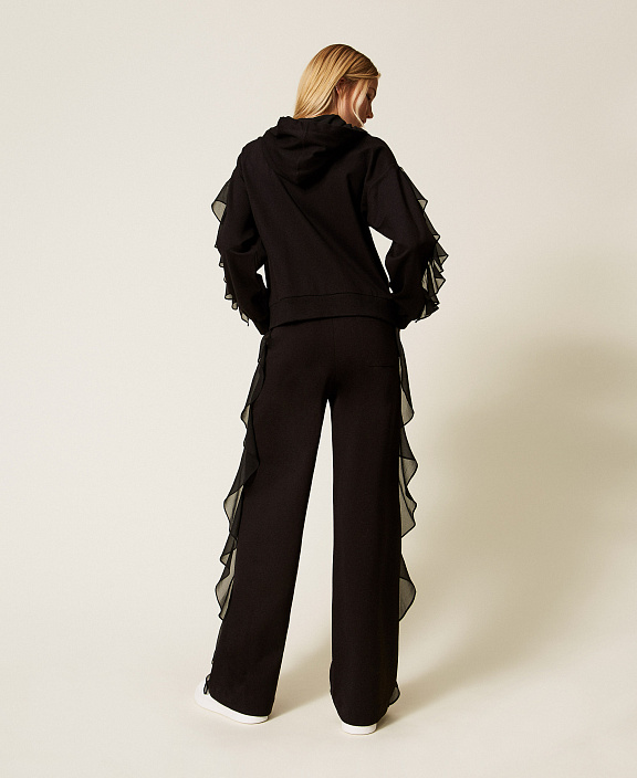 Брюки с оборками из жоржета