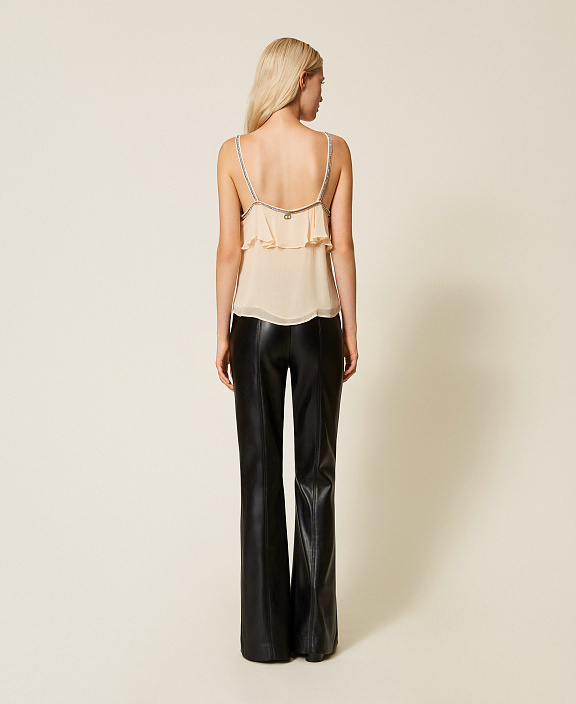 Брюки клеш с имитацией натуральной кожи с разрезами